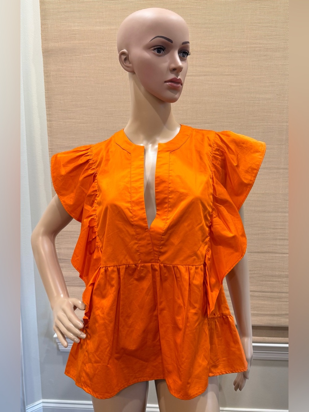 Kasia bright orange ruffle blouse. Structured V neckline. Size M. NWT